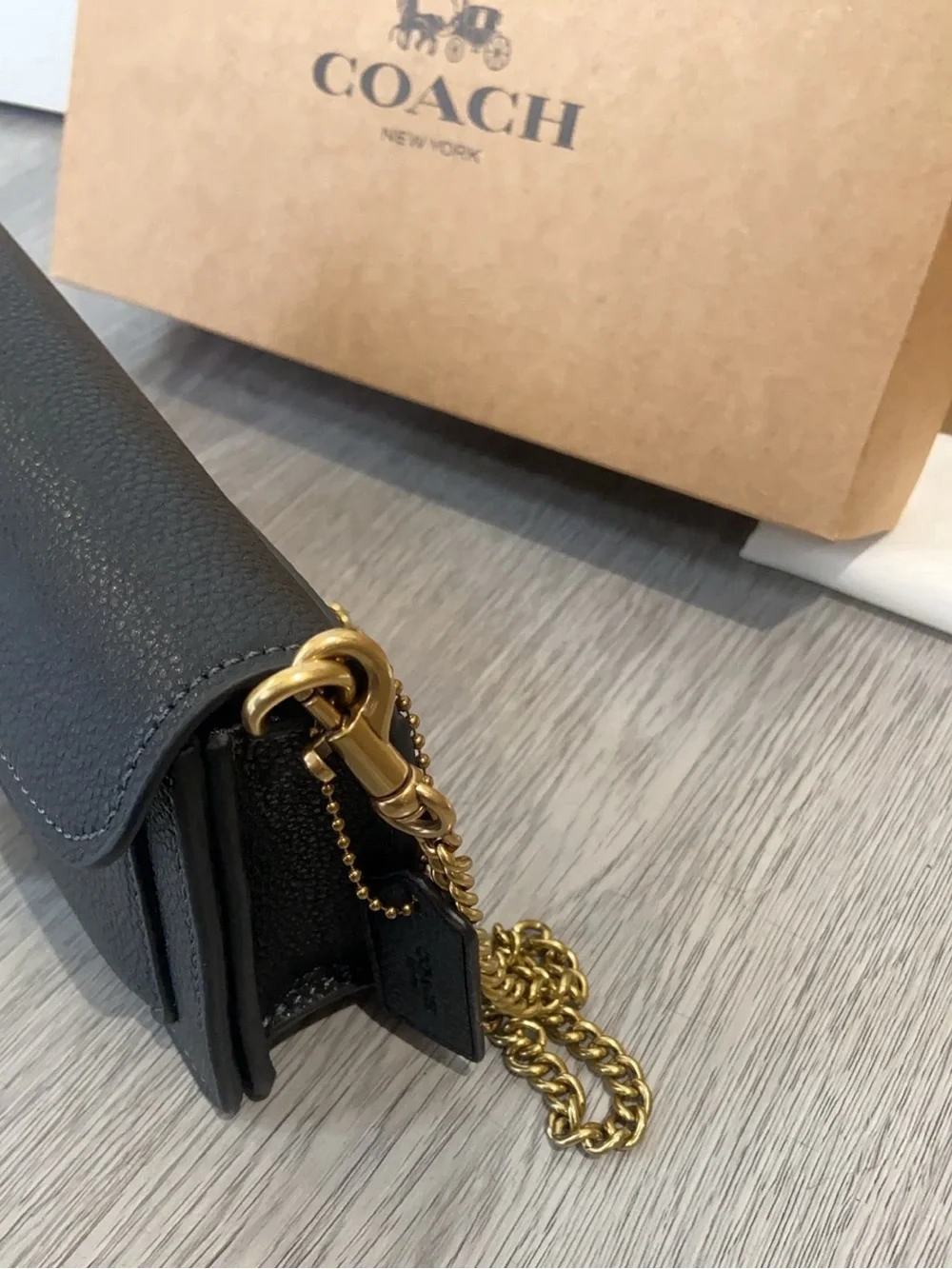 Coach Black Leather Crossbody with Gold 'C' Hardware and Chain Strap